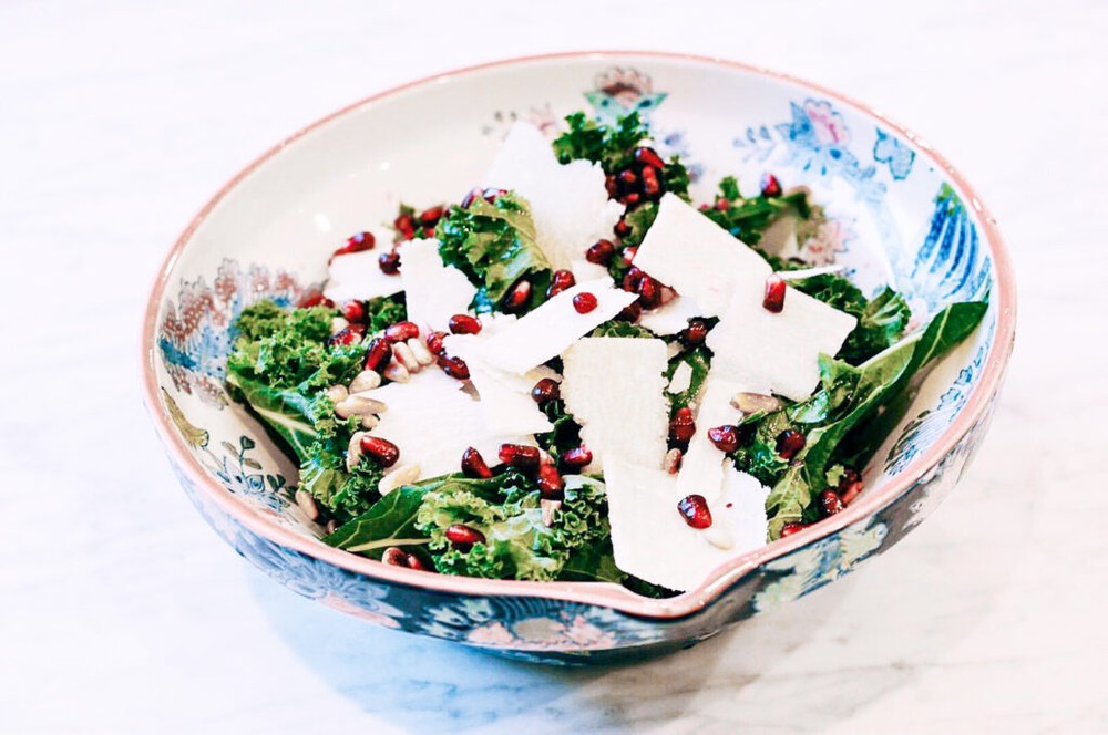 Kale salad with parmesan, pine nuts and pomegranate